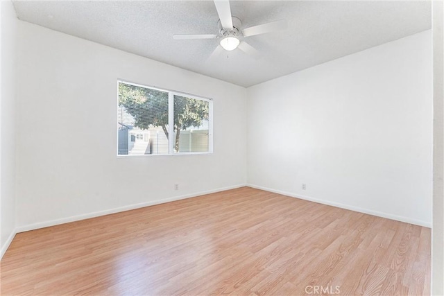 13421 Epping Way, Tustin, CA 92780 - spare room with light wood-style floors, baseboards, and ceiling fan