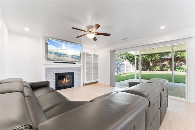 13421 Epping Way, Tustin, CA 92780 - living room featuring ceiling fan, light tile patterned floors, a brick fireplace, recessed lighting, and baseboards