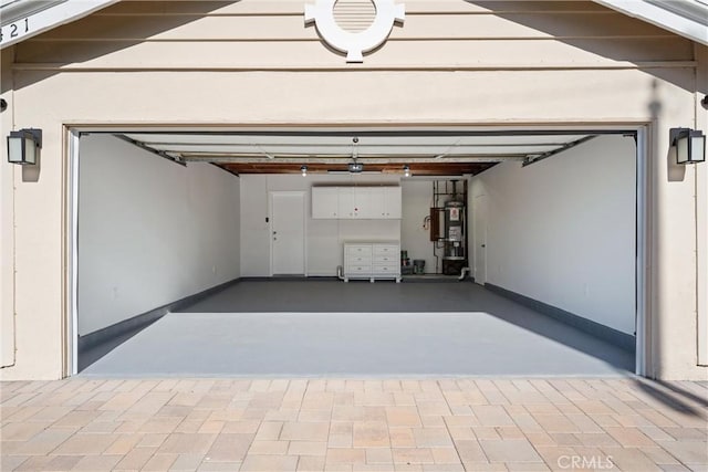 13421 Epping Way, Tustin, CA 92780 - garage with strapped water heater and driveway