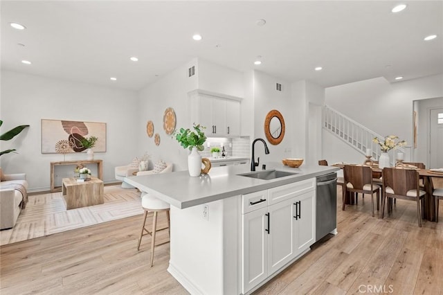937 E Wonder Ln, Glendora, CA 91740 - kitchen with a sink, light wood finished floors, recessed lighting, light countertops, and white cabinetry