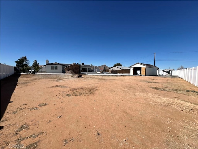 15245 Apache Rd, Apple Valley, CA 92307 - view of yard featuring an outdoor structure