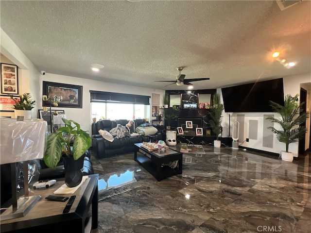 15245 Apache Rd, Apple Valley, CA 92307 - living area featuring a textured ceiling, ceiling fan, marble tiled flooring, and recessed lighting