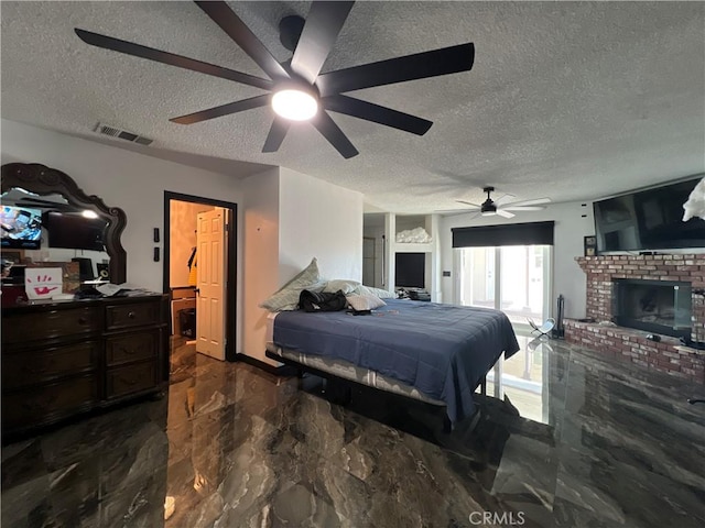 15245 Apache Rd, Apple Valley, CA 92307 - bedroom with a textured ceiling, marble tiled flooring, a fireplace, and ceiling fan