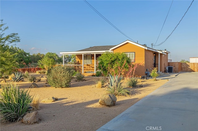 43156 41st St W, Lancaster, CA 93536 - view of front of home with covered porch, central air condition unit, and stucco siding