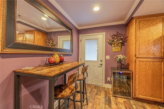 43156 41st St W, Lancaster, CA 93536 - dining room featuring wine cooler, wood finished floors, ornamental molding, baseboards, and recessed lighting