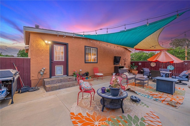 43156 41st St W, Lancaster, CA 93536 - patio terrace at dusk with an outdoor hangout area, a patio area, and area for grilling