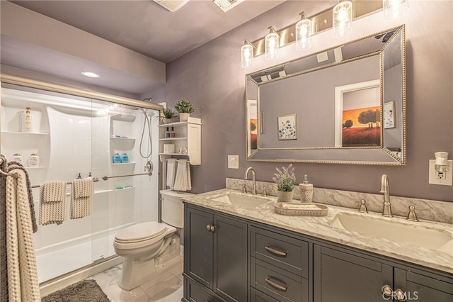 43156 41st St W, Lancaster, CA 93536 - full bathroom featuring marble finish floors, a shower stall, toilet, double vanity, and recessed lighting