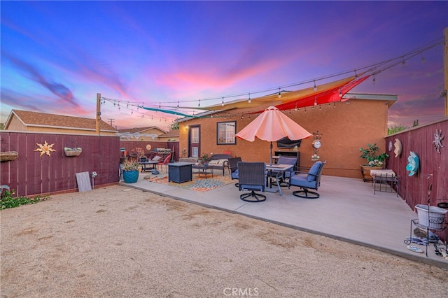 43156 41st St W, Lancaster, CA 93536 - patio terrace at dusk with a patio and a fenced backyard
