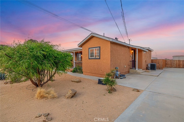 43156 41st St W, Lancaster, CA 93536 - view of front of home featuring central AC, stucco siding, and a patio