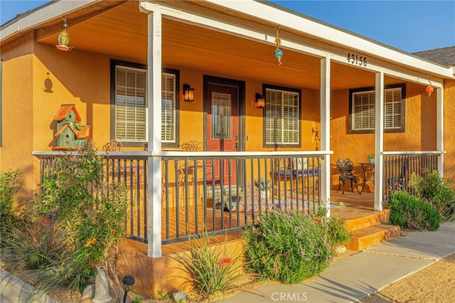 43156 41st St W, Lancaster, CA 93536 - view of exterior entry with a porch and stucco siding