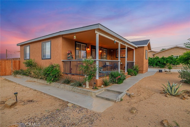 43156 41st St W, Lancaster, CA 93536 - view of front of home featuring a porch and stucco siding