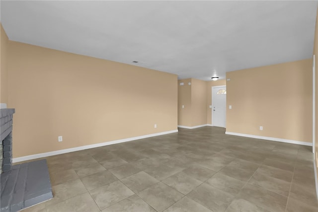 1018 N Millard Ave, Rialto, CA 92376 - unfurnished living room with a fireplace and baseboards