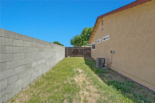 1018 N Millard Ave, Rialto, CA 92376 - view of yard featuring central AC unit