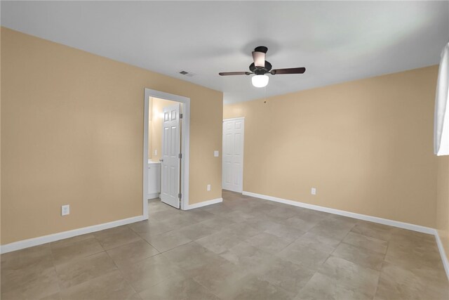 1018 N Millard Ave, Rialto, CA 92376 - unfurnished bedroom with baseboards, ensuite bath, and a ceiling fan
