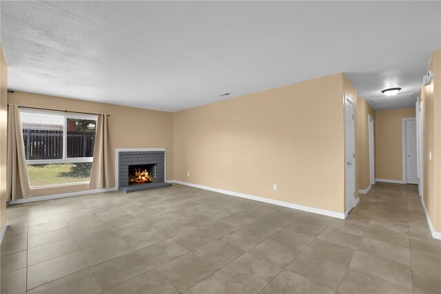 1018 N Millard Ave, Rialto, CA 92376 - unfurnished living room with a fireplace, baseboards, and light tile patterned flooring