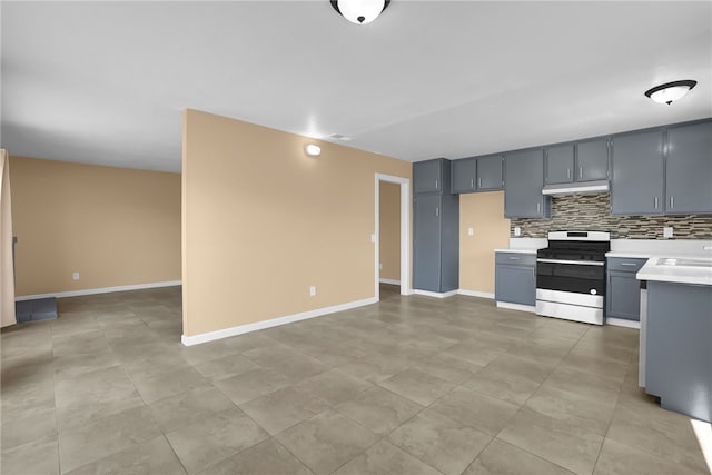 1018 N Millard Ave, Rialto, CA 92376 - kitchen with stainless steel gas range oven, light countertops, backsplash, under cabinet range hood, and gray cabinets