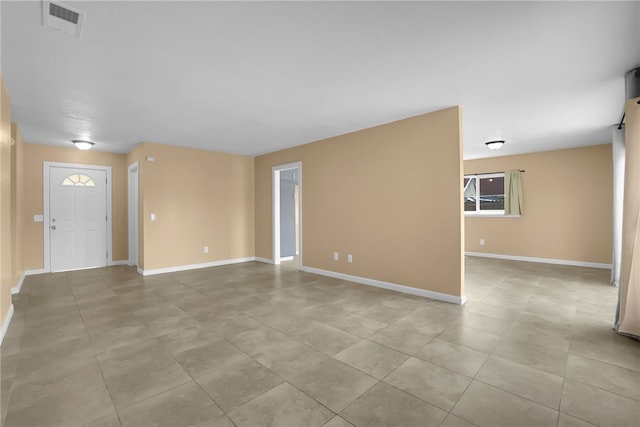 1018 N Millard Ave, Rialto, CA 92376 - empty room with baseboards and light tile patterned flooring