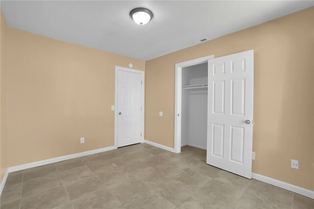 1018 N Millard Ave, Rialto, CA 92376 - unfurnished bedroom with baseboards and a closet