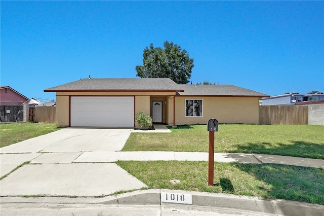 1018 N Millard Ave, Rialto, CA 92376 - ranch-style house featuring an attached garage, concrete driveway, and stucco siding