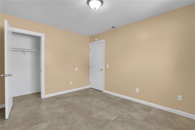 1018 N Millard Ave, Rialto, CA 92376 - unfurnished bedroom with baseboards and a closet