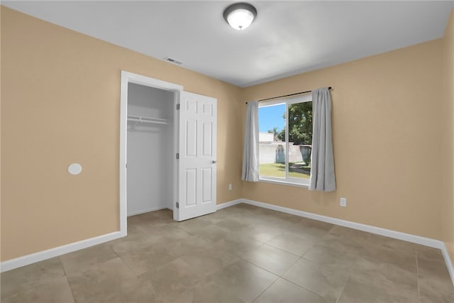 1018 N Millard Ave, Rialto, CA 92376 - unfurnished bedroom featuring baseboards, a closet, and tile patterned floors