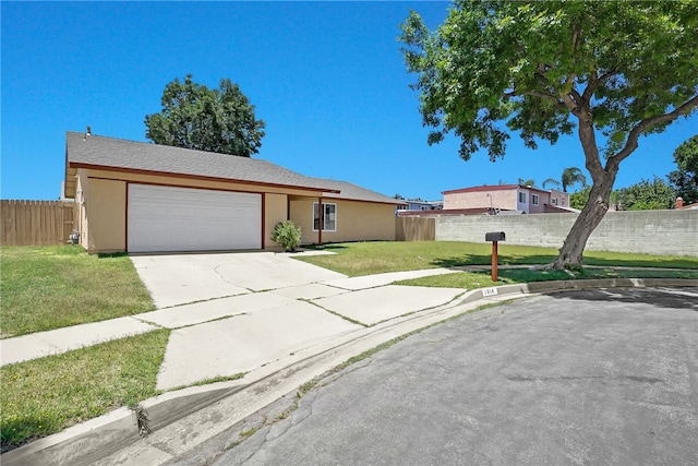 1018 N Millard Ave, Rialto, CA 92376 - single story home with an attached garage, concrete driveway, and stucco siding