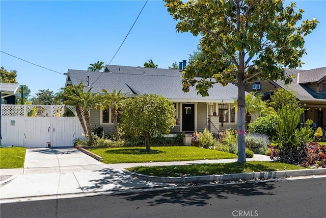 528 E Palmyra Ave, Orange, CA 92866 - view of front of house featuring a gate, roof with shingles, and driveway