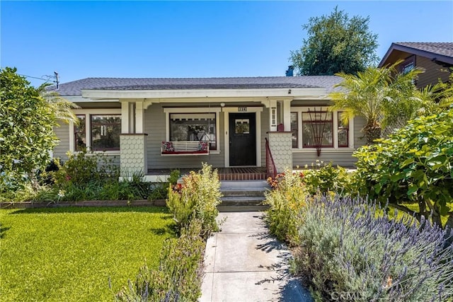 528 E Palmyra Ave, Orange, CA 92866 - view of front of house featuring a porch and a front yard