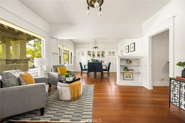 528 E Palmyra Ave, Orange, CA 92866 - living room with wood finished floors and a chandelier