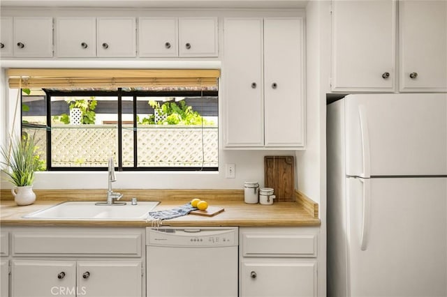 528 E Palmyra Ave, Orange, CA 92866 - kitchen with white appliances, white cabinetry, light countertops, and healthy amount of natural light