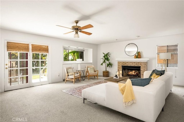 528 E Palmyra Ave, Orange, CA 92866 - carpeted living area with a ceiling fan and a fireplace