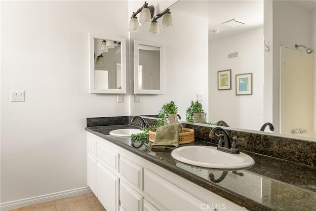528 E Palmyra Ave, Orange, CA 92866 - bathroom featuring double vanity, tile patterned flooring, and a chandelier
