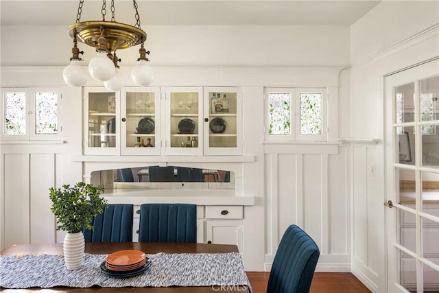 528 E Palmyra Ave, Orange, CA 92866 - dining space with a decorative wall, radiator, and dark wood-style flooring