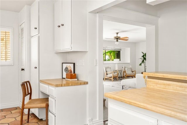 528 E Palmyra Ave, Orange, CA 92866 - kitchen featuring white cabinetry, light countertops, ceiling fan, and built in desk