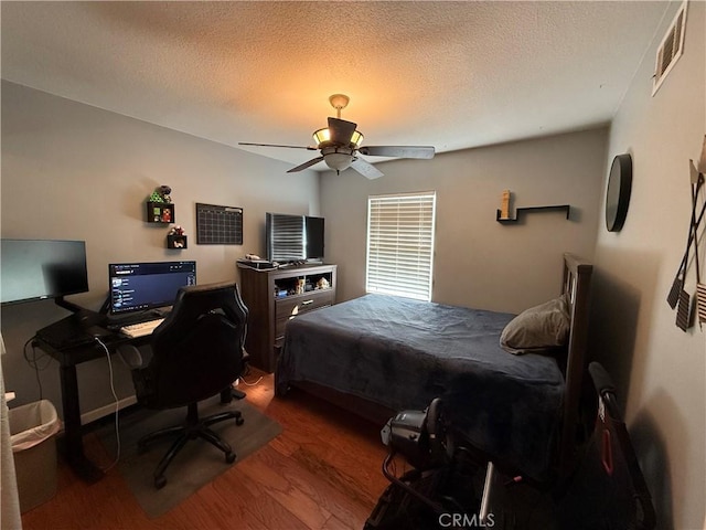 28726 Macklin Ave, Canyon Country, CA 91387 - bedroom featuring wood finished floors, a textured ceiling, and a ceiling fan