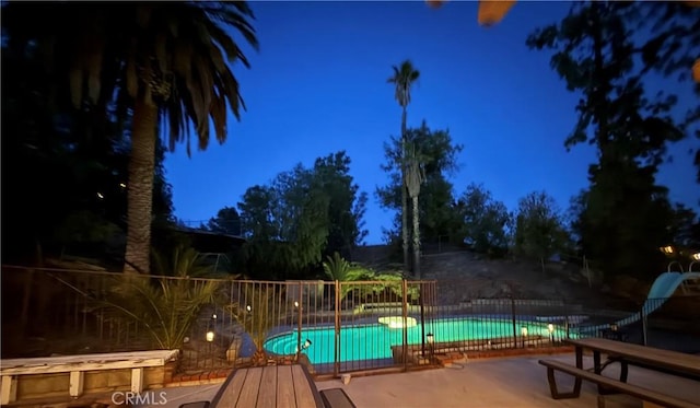 28726 Macklin Ave, Canyon Country, CA 91387 - pool at twilight featuring a water slide and a patio