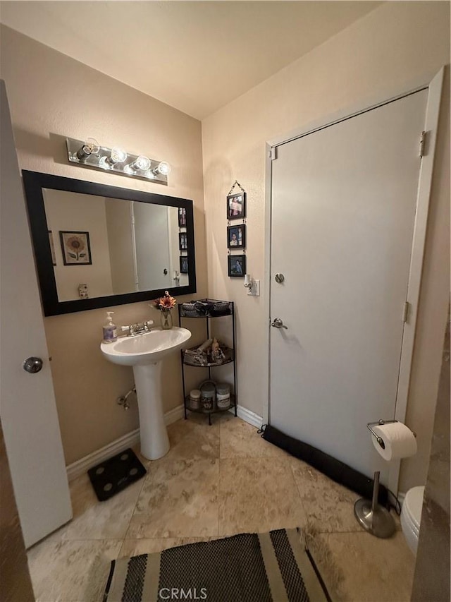 28726 Macklin Ave, Canyon Country, CA 91387 - bathroom featuring toilet, baseboards, and tile patterned flooring