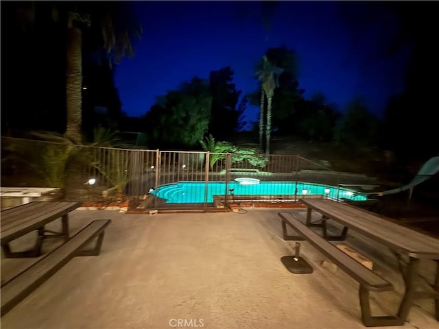 28726 Macklin Ave, Canyon Country, CA 91387 - pool at night with a patio area