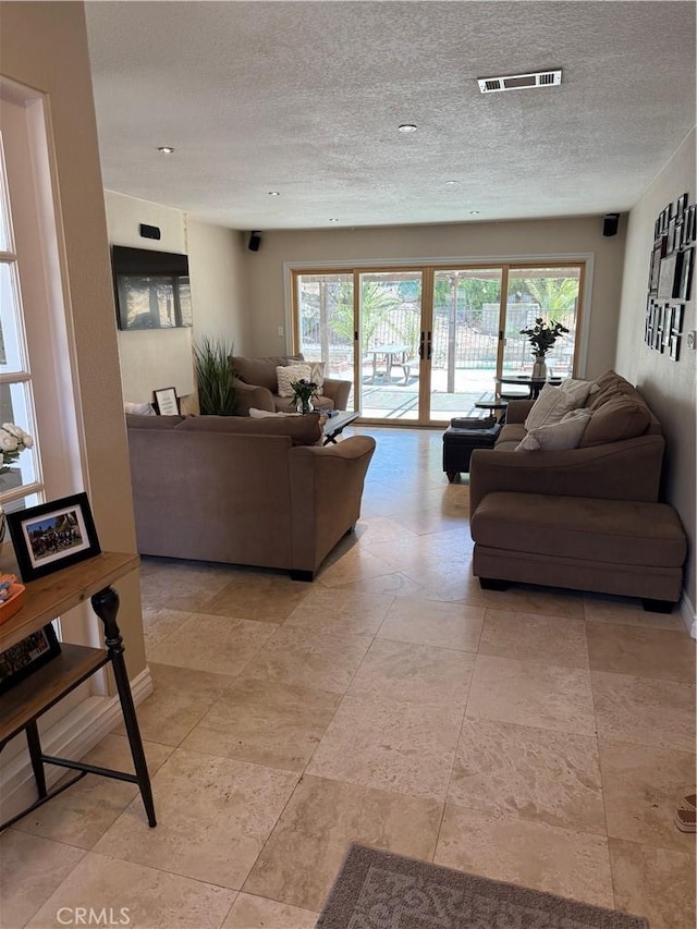 28726 Macklin Ave, Canyon Country, CA 91387 - living room featuring a textured ceiling and french doors