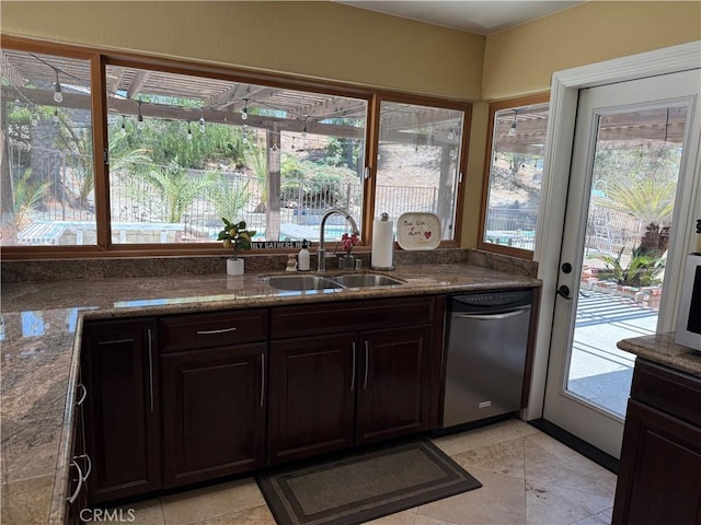 28726 Macklin Ave, Canyon Country, CA 91387 - kitchen with a sink, stainless steel dishwasher, healthy amount of natural light, and dark stone countertops