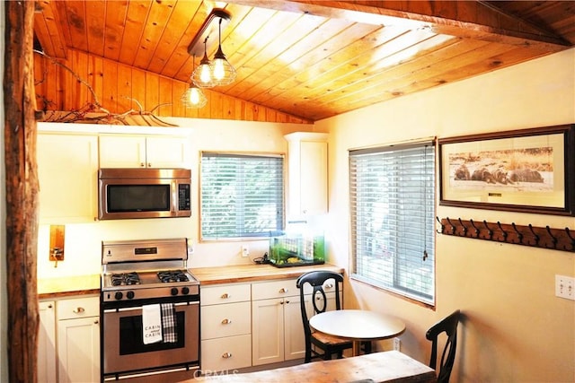657 Moreno Ln, Sugarloaf, CA 92386 - kitchen with appliances with stainless steel finishes, vaulted ceiling, wood ceiling, white cabinets, and hanging light fixtures