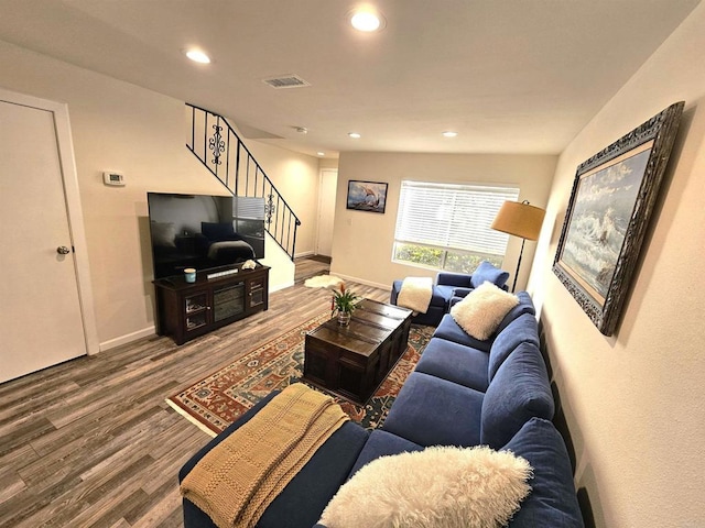 living room with wood finished floors, stairs, recessed lighting, and baseboards