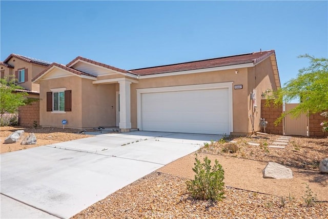 15667 San Diego Ln, Victorville, CA 92394 - single story home featuring an attached garage, concrete driveway, stucco siding, and a tiled roof