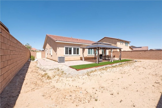 15667 San Diego Ln, Victorville, CA 92394 - back of property featuring a gazebo, a patio area, stucco siding, and a fenced backyard