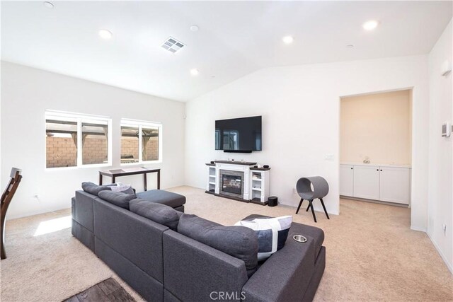 15667 San Diego Ln, Victorville, CA 92394 - living area featuring light carpet, lofted ceiling, a fireplace, and recessed lighting
