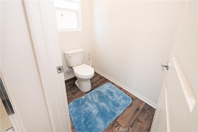 15667 San Diego Ln, Victorville, CA 92394 - bathroom with wood finished floors, toilet, and baseboards