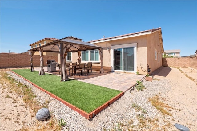 15667 San Diego Ln, Victorville, CA 92394 - back of house with a gazebo, a patio, and stucco siding