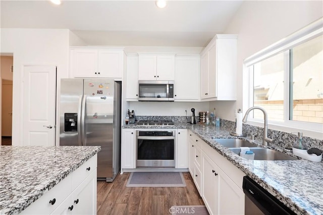 15667 San Diego Ln, Victorville, CA 92394 - kitchen featuring stainless steel appliances, a sink, light wood-style floors, white cabinets, and light stone counters