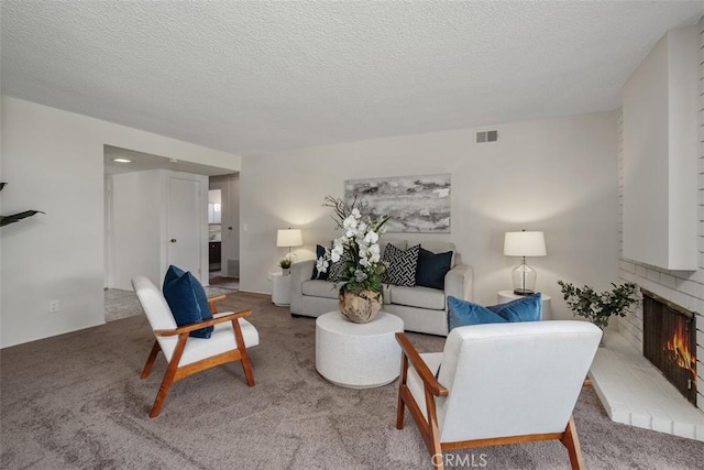 251 Mountain Crest Rd, Duarte, CA 91010 - living area featuring a brick fireplace, carpet flooring, and a textured ceiling