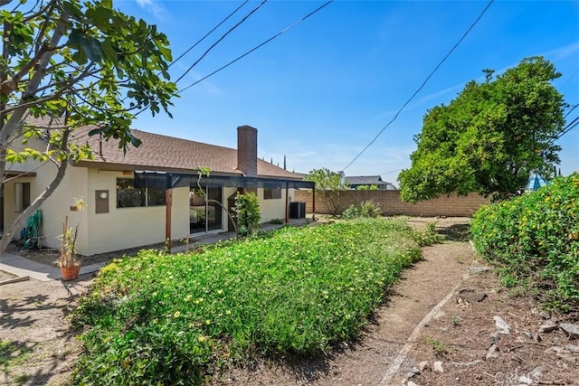 251 Mountain Crest Rd, Duarte, CA 91010 - back of house with stucco siding and a chimney